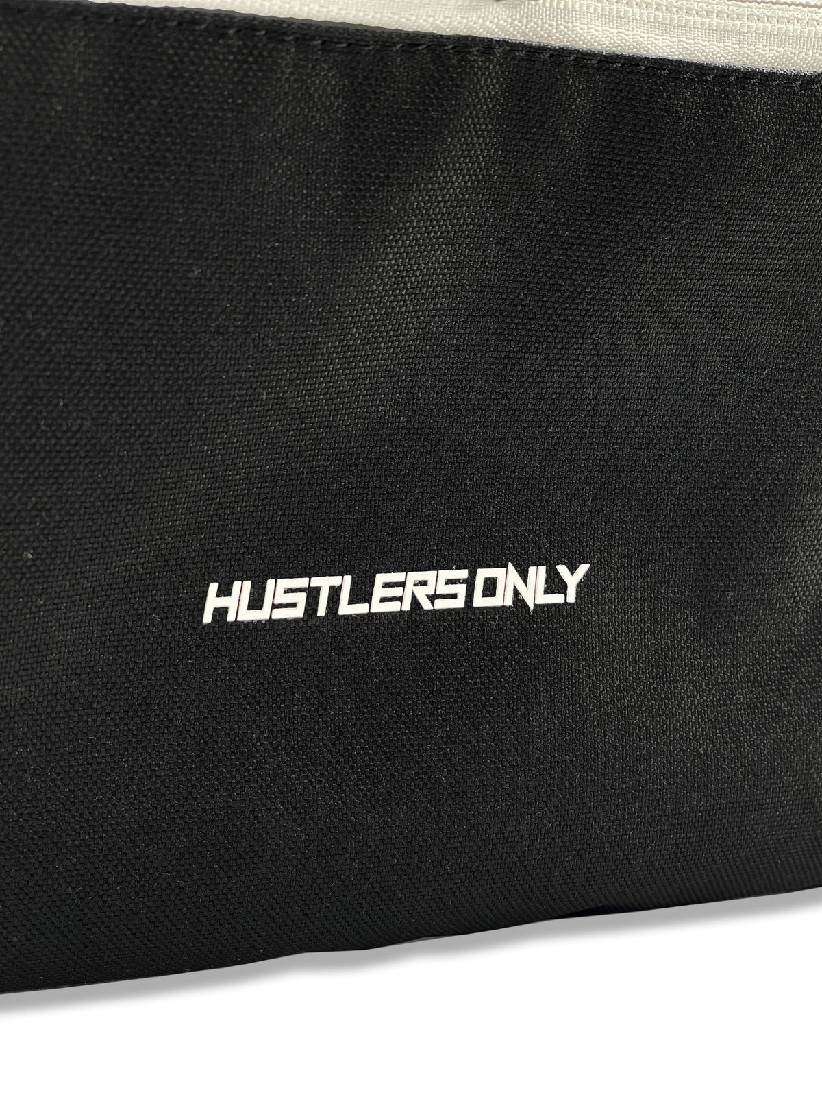 Detailed view of Hustlers Only black mini backpack showing zipper and stitching