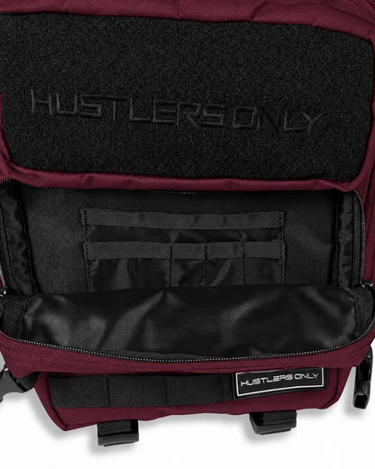 Hustlers Only Beta Military Backpack in maroon with tactical design and multiple front storage compartments