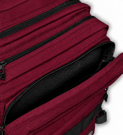 Side view of Beta Military Backpack Maroon showing bottle holder and tightening straps