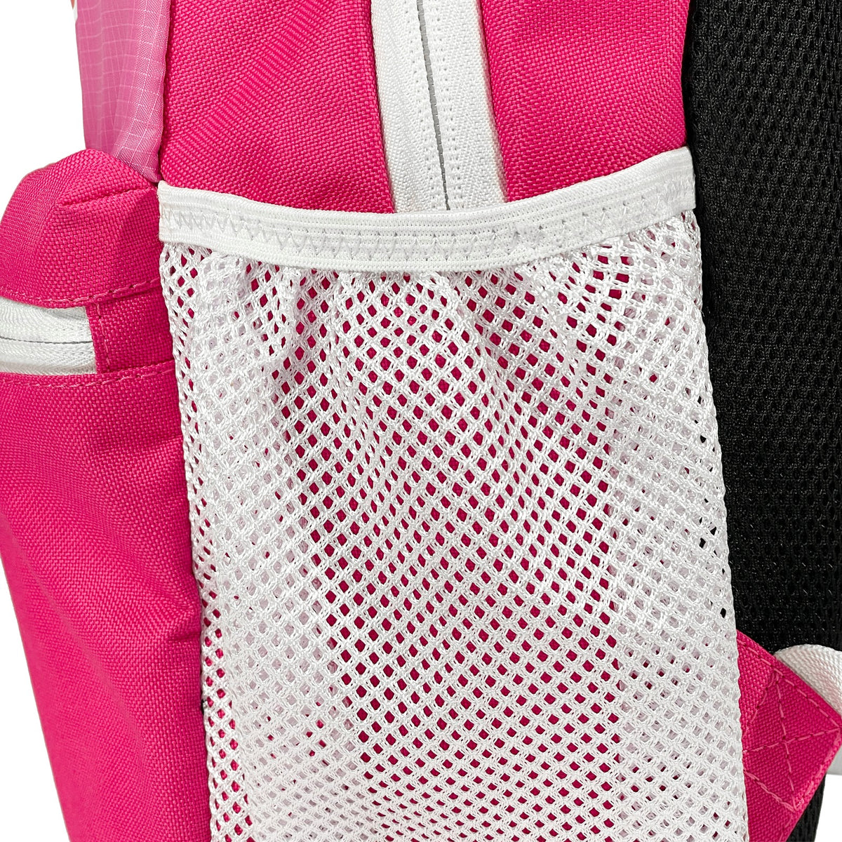 Side view of Active Mini Backpack in pink showing dual water bottle holders
